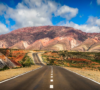 San Salvador de Jujuy, Jujuy, Argentina Concrete Road Near Brown Mountain Under Blue Sky