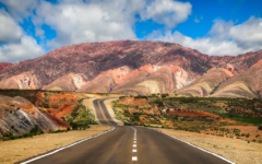 San Salvador de Jujuy, Jujuy, Argentina Concrete Road Near Brown Mountain Under Blue Sky