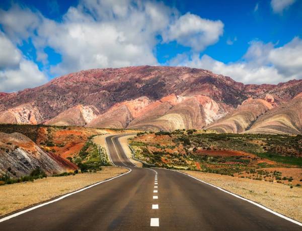 San Salvador de Jujuy, Jujuy, Argentina Concrete Road Near Brown Mountain Under Blue Sky