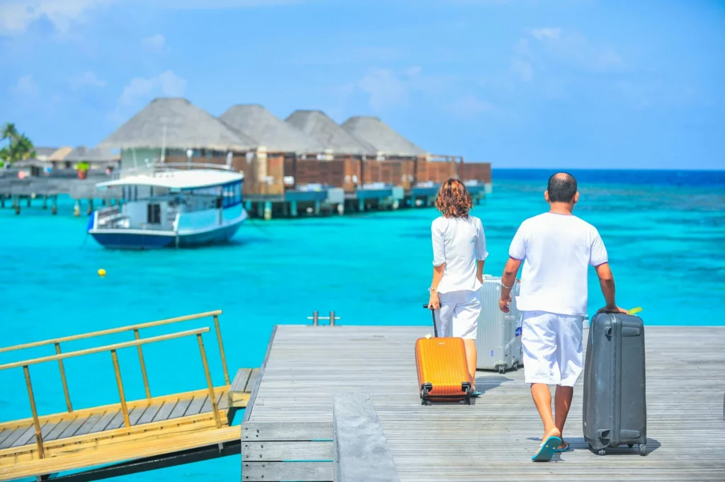 Man and Woman Walks on warm Dock, Maldives